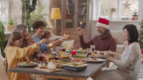 Happy Family Celebrates Christmas at Home With Sparklers