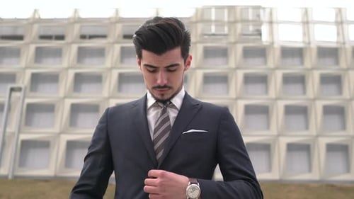Confident Businessman in Suit Outside Modern Building