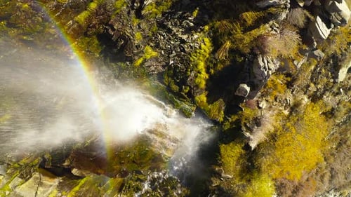 The View From Above Over the Mountain Waterfall Streaming Under the Bright Autumn Sun.