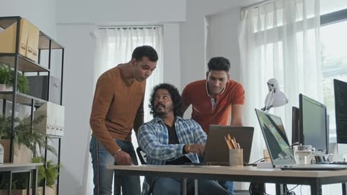 Team of Indian Programmers Discussing Work in Office