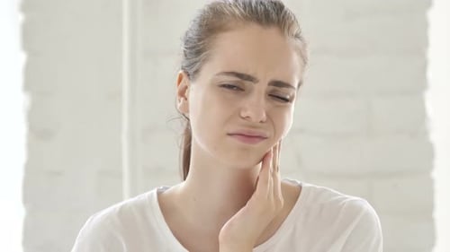 Woman Experiencing Tooth Pain Close Up