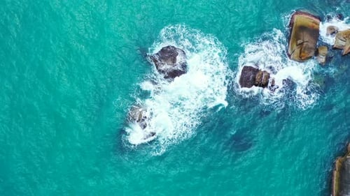 Aerial top down seascape of beautiful tourist beach holiday by shallow water and white sandy backgro