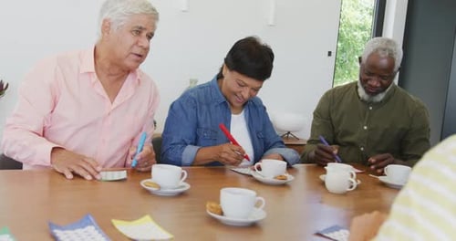 Seniors Enjoying Friendly Bingo Game Together