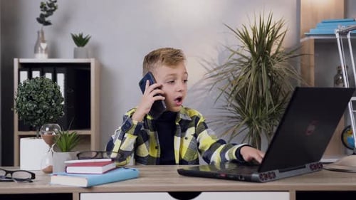 Child Works on Laptop While Talking on Phone