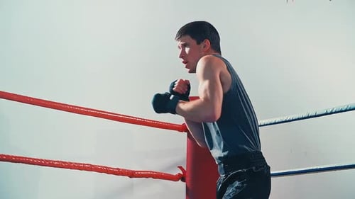 Man Boxing in Ring, Practicing Punches