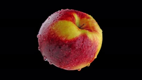 Apple rotiert auf schwarzem Hintergrund
