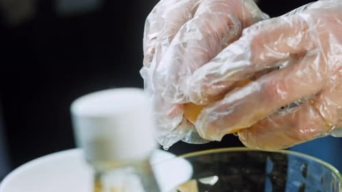 Hands Separate Egg Yolk From Egg White