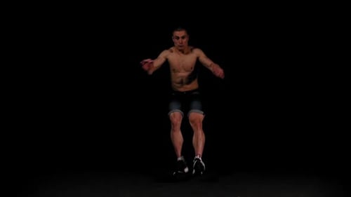 Young Pumped Man Runs Out of the Dark and Doing a Flip in the Arena