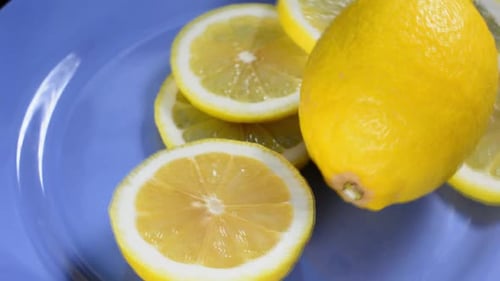 Fresh Sliced Lemons on a Light Blue Plate
