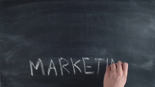 Writing Marketing on Chalkboard with Related Images