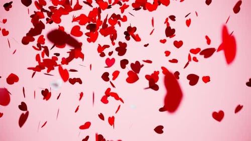Red heart-shaped confetti explosion. Cute romantic birthday decorations.Surprise