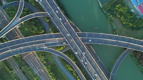Aerial Drone View of Highway Multi-level Junction Road with Moving Car at Sunset,Active Movement