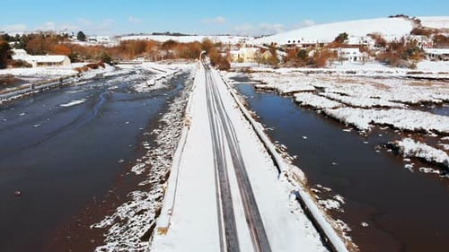 Snow Covered Railway Line in Winter Landscape