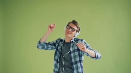 Man Dancing to Music With Headphones On