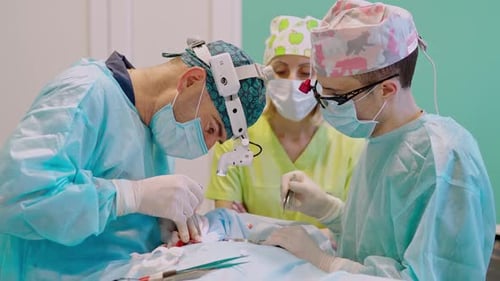 Medical Team Performing Surgery in Operating Room