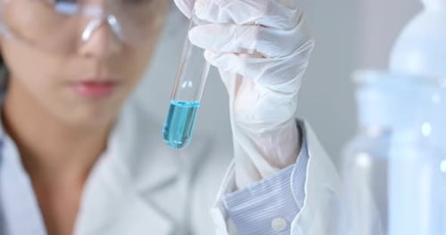 Scientist Holding Test Tube in Laboratory