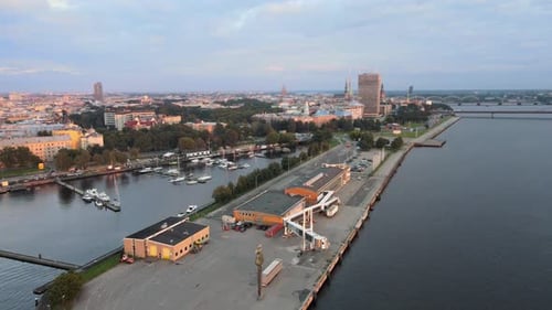 Aerial View of Cityscape at Sunrise Over Harbor