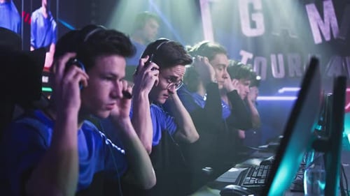 Young Gamers Putting on Headphones Before Match