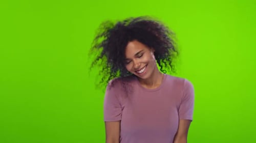 Young Woman Dances Energetically on Green Screen