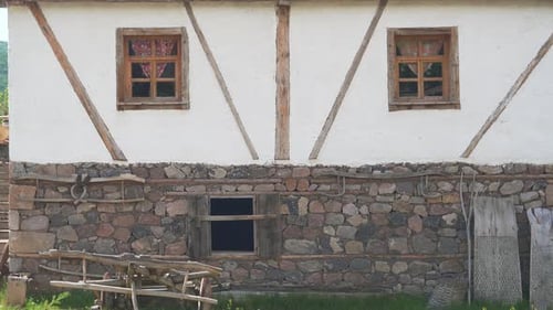 Village House With Stone and Wooden Walls