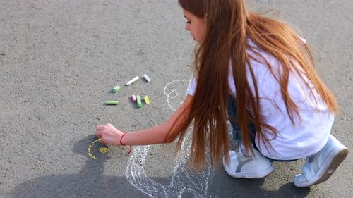 Little Girl with Creative Craft Hobby Drawing Electro on the Asphalt with Chalk Car Environment Eco