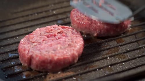 Close Up. Cooking Delicious Burgers, Meat Cutlets Fried on the Grill Barbecue
