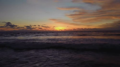 Flight at Sunset Overlooking the Indian Ocean in Bali Indonesia