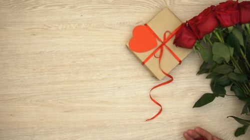 Engagement Ring, Roses, and Gift Box Overhead