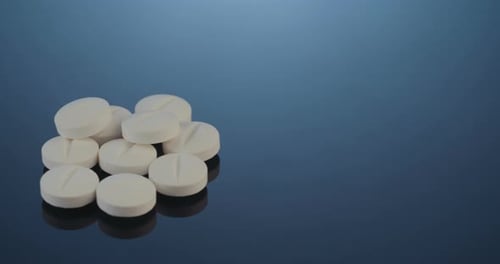 Pills in a Group on Blue Background