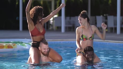 Happy Diverse Friends Having Fun in Swimming Pool