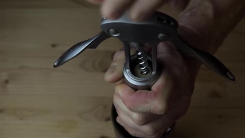 Opening A Wine Bottle With Corkscrew Close Up