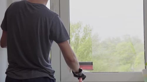 Adult Cleaning Window with Squeegee Inside