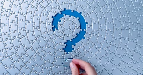 Grey Puzzles Isolated On Blue Background. Social Issue Concept