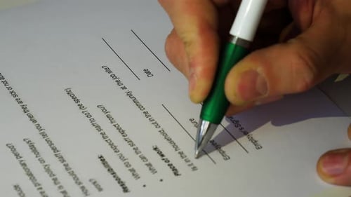 Hand Signs Form with Pen on Desk