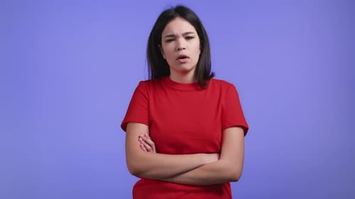 Bored Young Woman With Arms Crossed