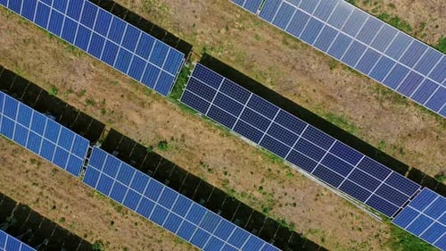 Vast Solar Panel Array in Rural Landscape