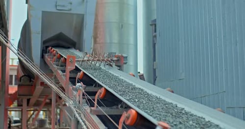 Construction Conveyor Belt Stones and Crushed Stone are Lifted Into the Hopper