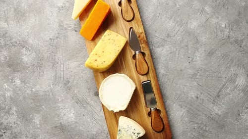 Aerial View of Cheese Board with Knives
