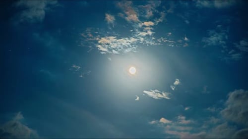 Full Moon with Ethereal Clouds Moving Across Night Sky