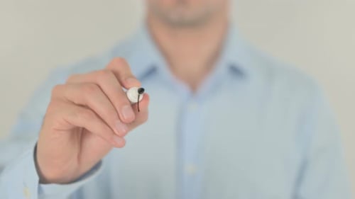 Man Writes Patent Law with Black Marker