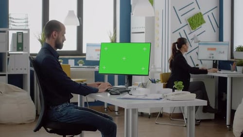 Businessman Using Keyboard and Horizontal Green Screen