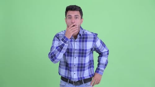 Young Handsome Hispanic Man Looking Shocked