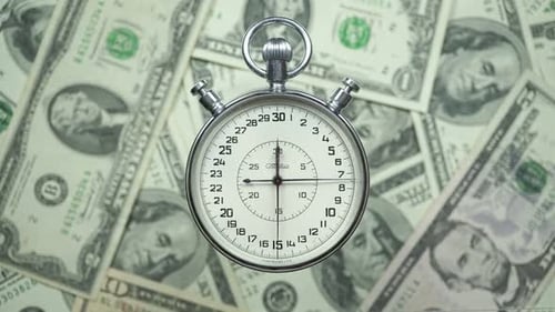 Stopwatch on Dollars: Time is Money Concept