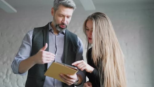 Colleagues Are Using in Modern Office Tablet and Discussing Over New Business Plan