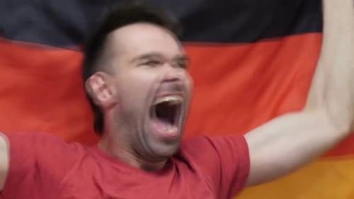 Man Cheers with German Flag Close Up