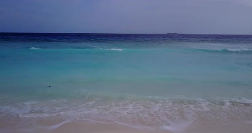Natural above tourism shot of a sunshine white sandy paradise beach and turquoise sea background in