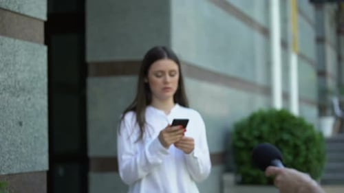 Female Going Out From Apartment Rejecting Giving Interview