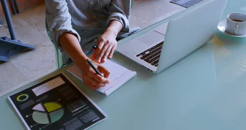 Writing at Desk with Laptop and Tea