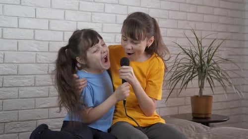 Girls Singing Karaoke Together at Home