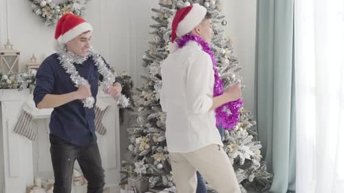 Friends Celebrate Christmas in Decorated Living Room